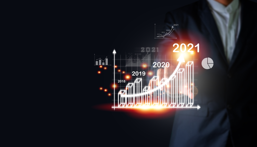 Business man with a graphic showing yearly increases