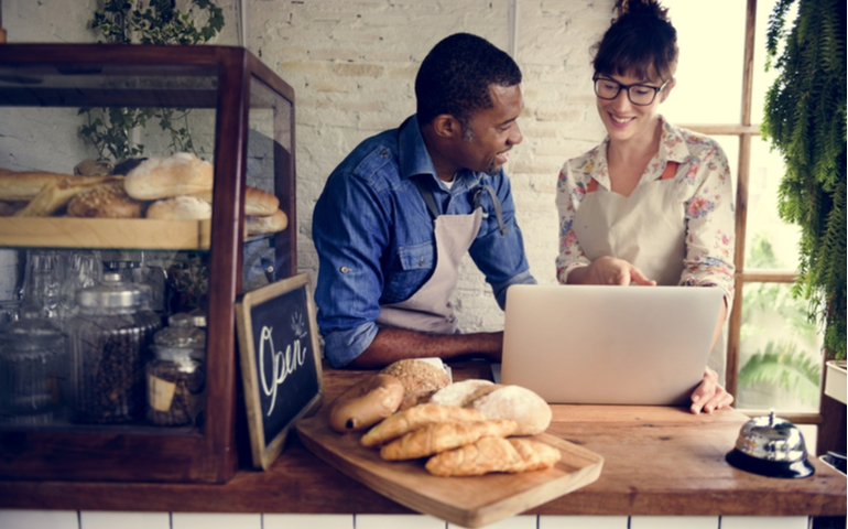 People smiling in a cafe business