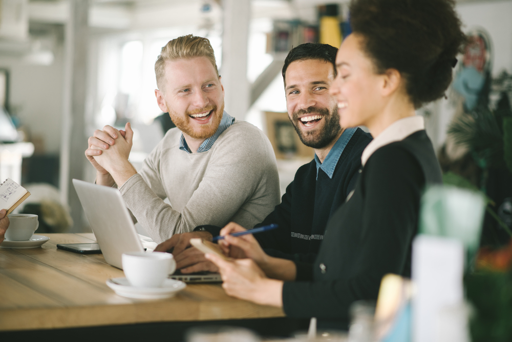 Employees smiling in an office environment